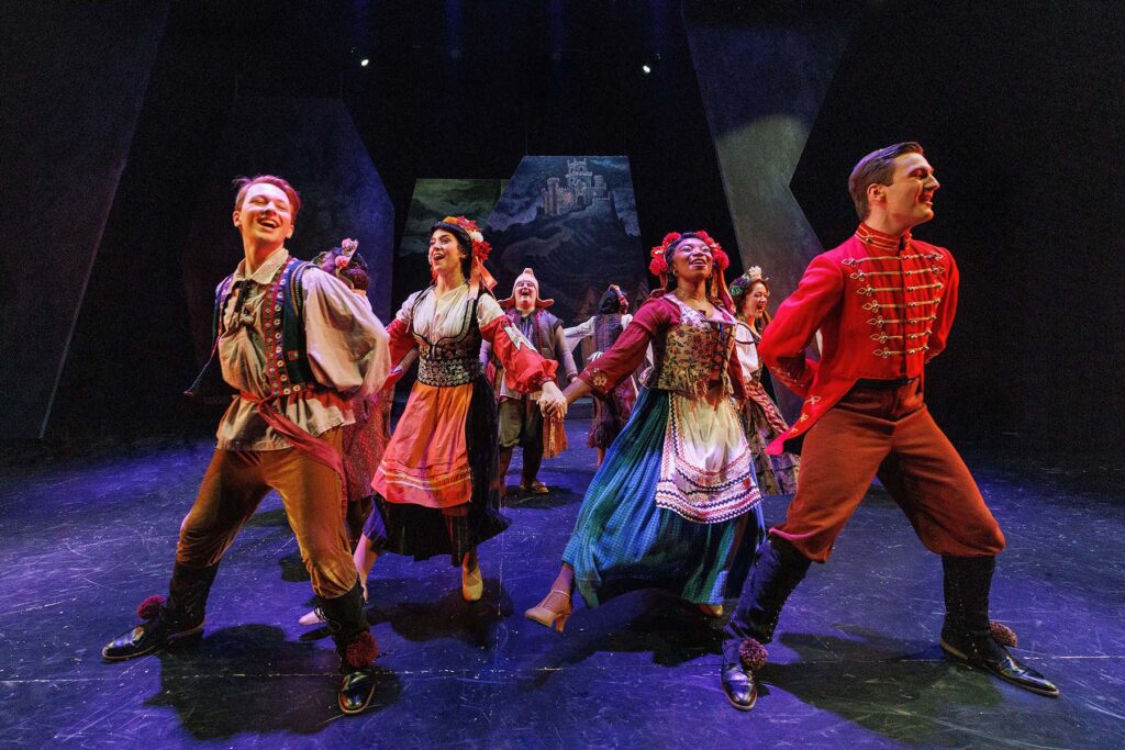 there is a group of people that are dancing on a stage