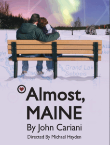 there is a man and a woman sitting on a bench in the snow